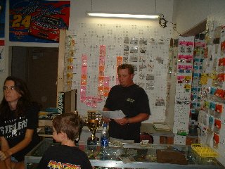 The Edwards family around the shop counter